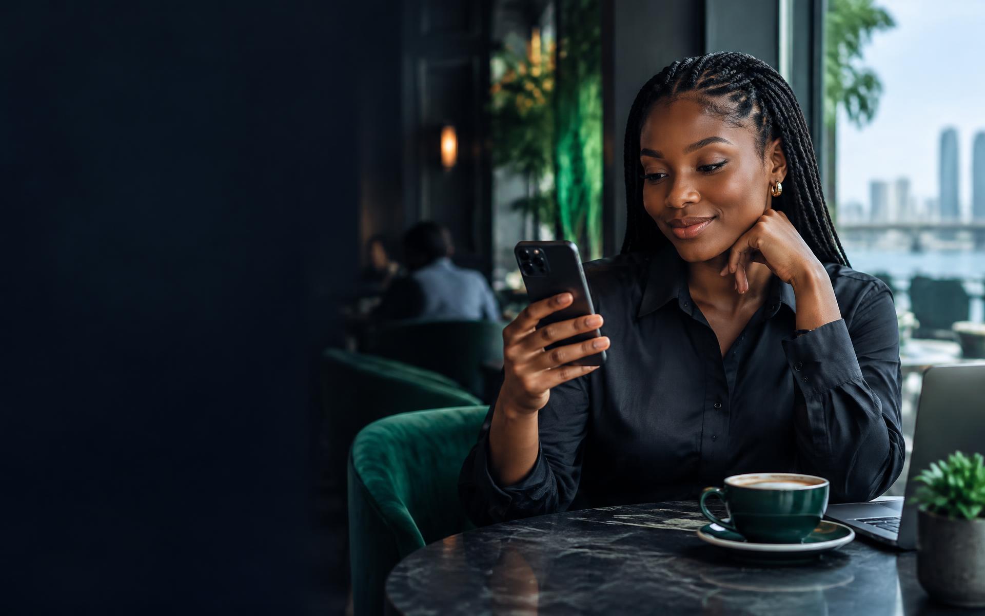 Woman checking her phone in a cafe